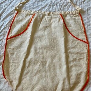 Vintage Child’s Cream Apron with Orange Trim
